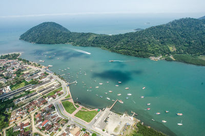 High angle view of sea and bay against sky