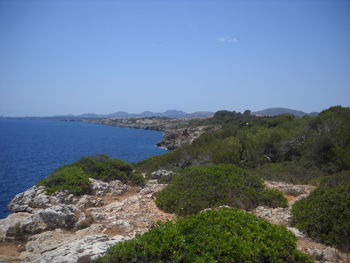 Scenic view of sea against clear blue sky