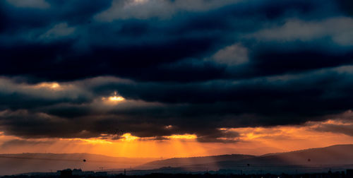 Scenic view of dramatic sky during sunset