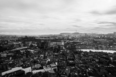Cityscape against cloudy sky