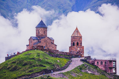 Historic building against cloudy sky