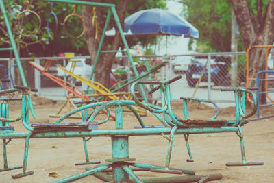 Empty chairs and tables in park