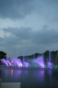 Reflection of illuminated buildings in water at night