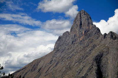 Low angle view of rock formations against sky