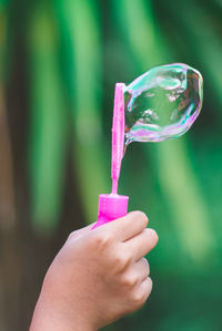 Close-up of hand holding ice cream