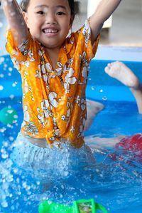 Portrait of smiling girl in swimming pool