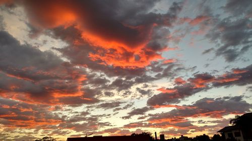 Low angle view of dramatic sky during sunset