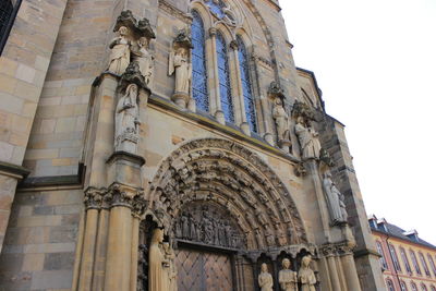 Low angle view of historic church against sky