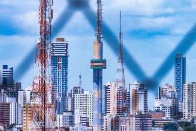 Modern buildings against sky in city