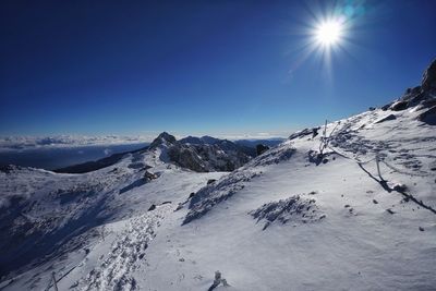 Scenic view of snowcapped mountains against sky