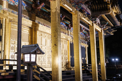 Low angle view of illuminated building at night