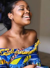 Portrait of a smiling young woman looking away