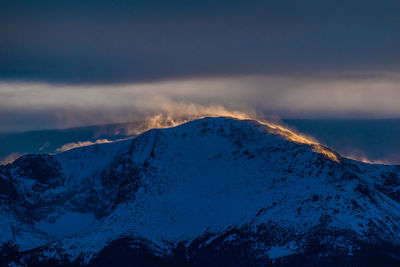 Scenic view of mountains against sky during winter