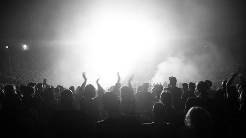 People enjoying music concert