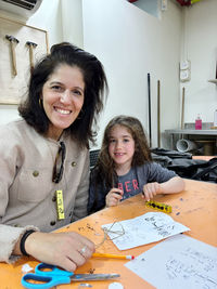 Portrait of young woman working at home