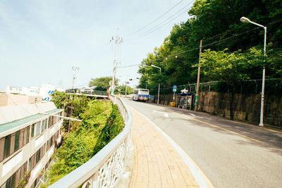 Road in city against sky