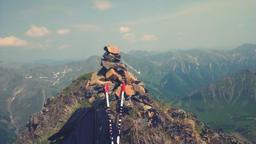 Panoramic view of person on mountain against sky