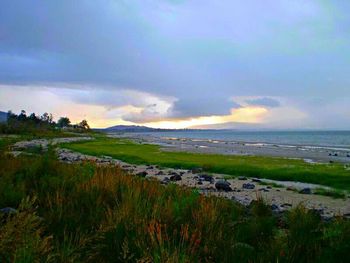 Scenic view of sea against cloudy sky