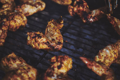 High angle view of meat on barbecue grill