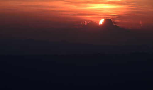 Silhouette landscape against sky during sunset