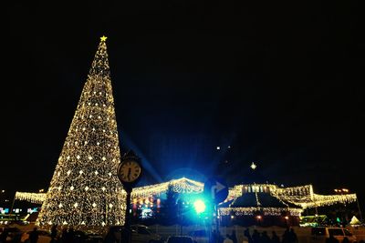 Illuminated christmas tree at night