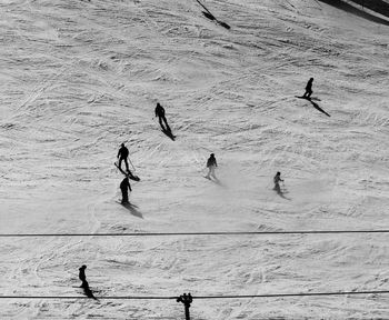 High angle view of people skiing on snow