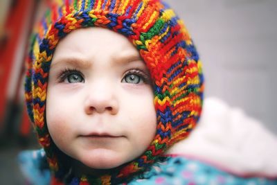 Close-up portrait of baby girl in warm clothes