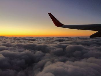 Cloudscape seen through airplane wing