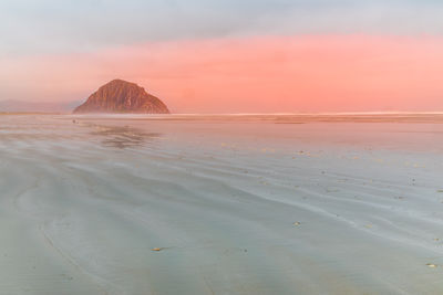 Dreamy morning on the beach of morro bay with the morro rock, california