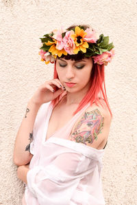 Portrait of young woman with bouquet