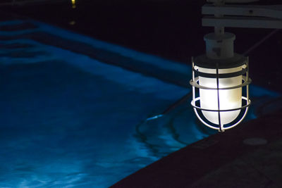 High angle view of illuminated lamp in swimming pool