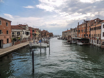 A canal with boats in venice italy.