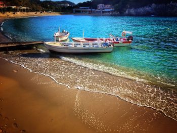 Boats moored on sea