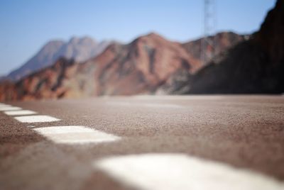 Surface level of road against mountain range