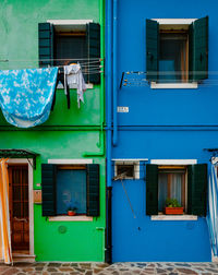 Characteristic green and blue colored houses in burano