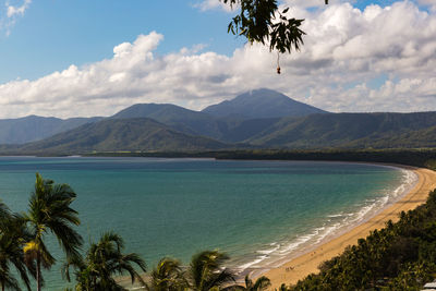 Scenic view of sea and mountains against sky