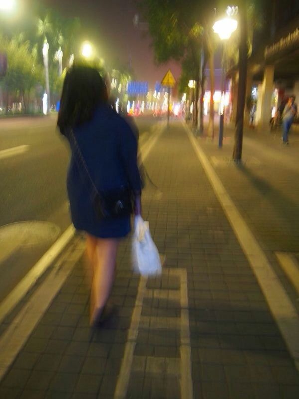 illuminated, night, lifestyles, full length, rear view, leisure activity, men, walking, city, person, city life, casual clothing, street, incidental people, the way forward, lighting equipment, sidewalk