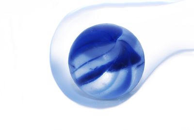 Close-up of blue balloon against white background