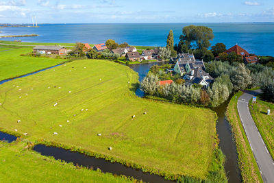 High angle view of sea shore against sky