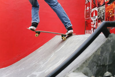 Low section of man skateboarding