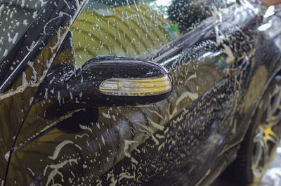 Close-up of car getting washed