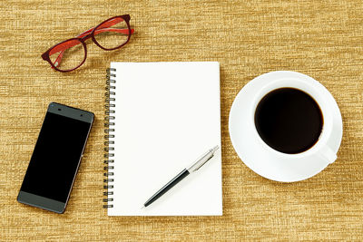 Directly above shot of coffee cup on table