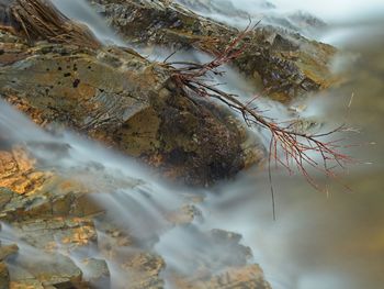High angle view of rocks in sea
