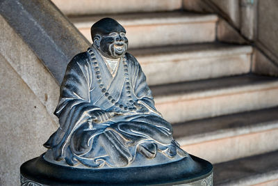 Buddha statue on staircase