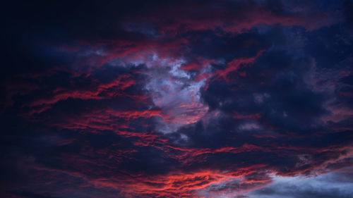 Low angle view of dramatic sky at sunset