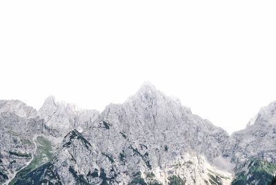 Scenic view of snowcapped mountains against clear sky