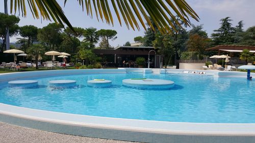 View of swimming pool against blue sky