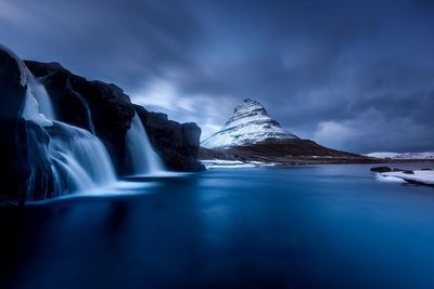 Scenic view of snowcapped mountain against sky
