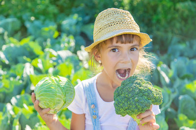 Portrait of girl eating cabbage