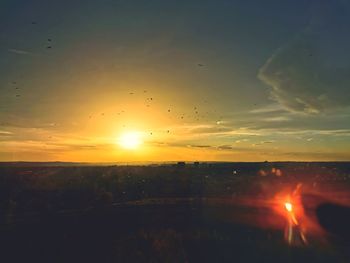 Silhouette landscape against sky during sunset